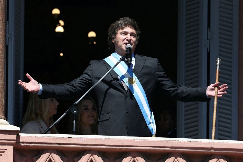 &copy; Reuters. FILE PHOTO: Argentina's President Javier Milei addresses supporters from the Casa Rosada balcony, as his sister Karina Milei and his partner Fatima Florez look on, after his swearing-in ceremony, in Buenos Aires, Argentina December 10, 2023. REUTERS/Agust