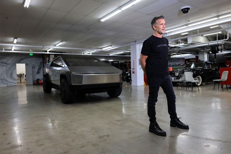 © Reuters. Tesla's chief designer Franz von Holzhausen poses next to a Tesla prototype at the Petersen Automotive Museum in Los Angeles, California, U.S. December 21, 2023.   REUTERS/David Swanson