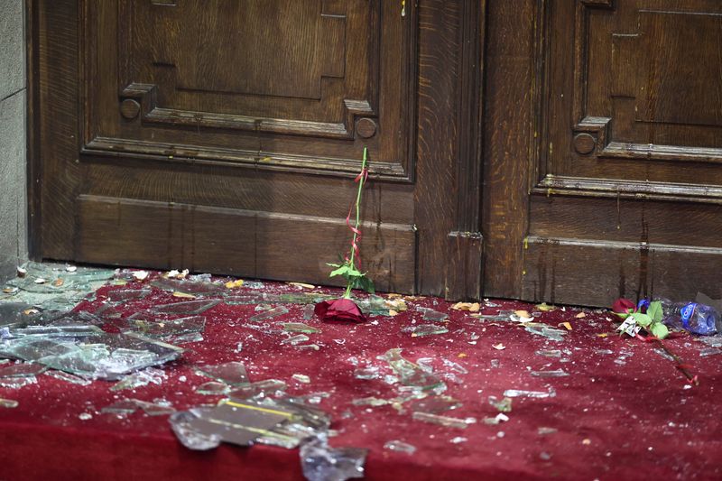 &copy; Reuters. A flower is seen amid the broken glass of the door of the city hall during a protest by supporters of the opposition 'Serbia Against Violence' (SPN), after the SPN alleged major election law violations in the Belgrade city and parliament races, in Belgrad