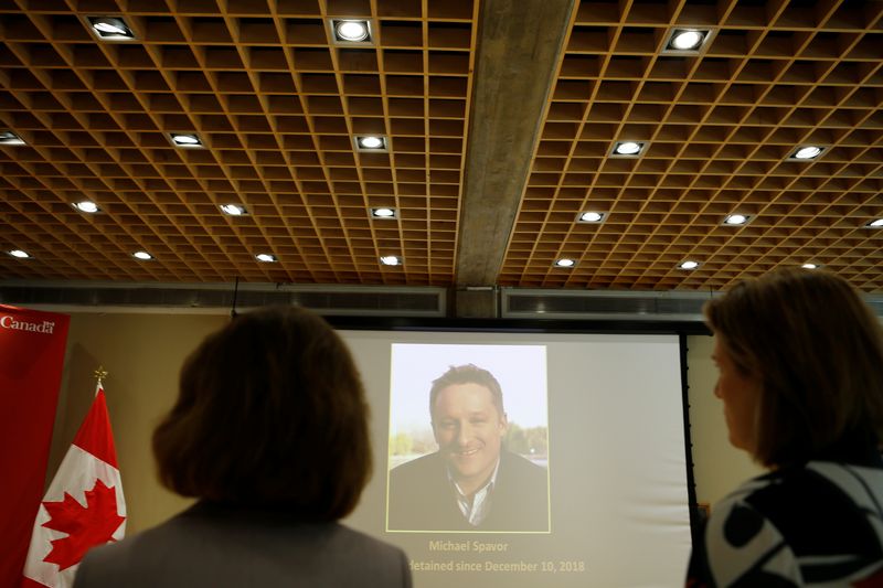 &copy; Reuters. An image of Canadian Michael Spavor, charged with espionage in June 2019, is projected on a screen at the Canadian embassy in Beijing, China August 11, 2021. REUTERS/Florence Lo/File Photo