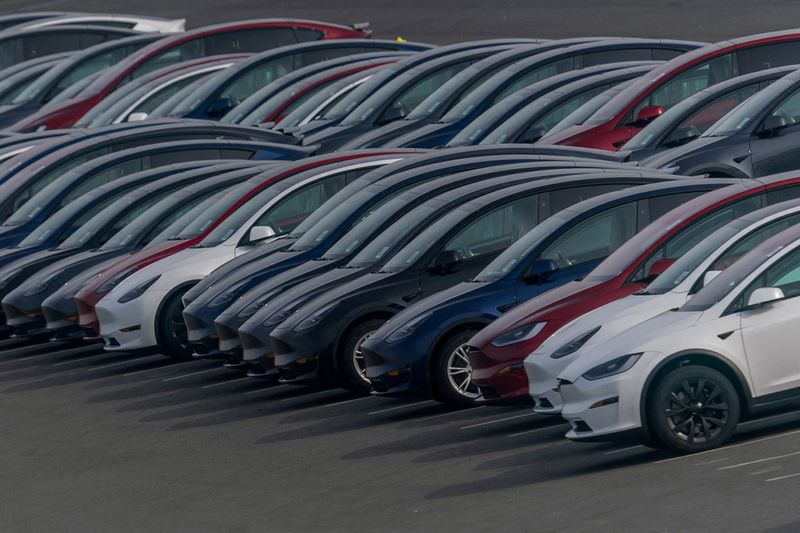 &copy; Reuters. FILE PHOTO: Tesla vehicles are parked at a parking lot as the company is recalling over 2 million vehicles in the U.S. to install new safeguards in its Autopilot advanced driver-assistance system, after a federal safety regulator cited safety concerns, in