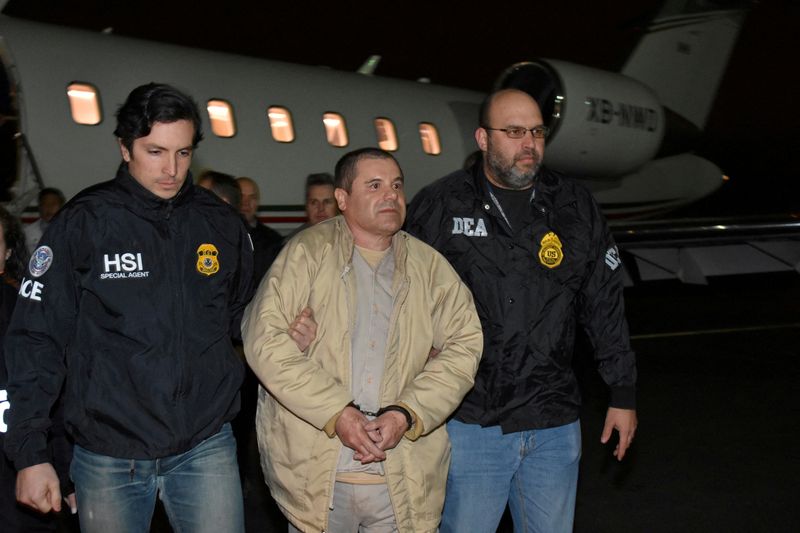 &copy; Reuters. FILE PHOTO: Mexico's top drug lord Joaquin "El Chapo" Guzman is escorted as he arrives at Long Island MacArthur airport in New York, U.S., January 19, 2017, after his extradition from Mexico. U.S. officials/Handout via REUTERS/File Photo