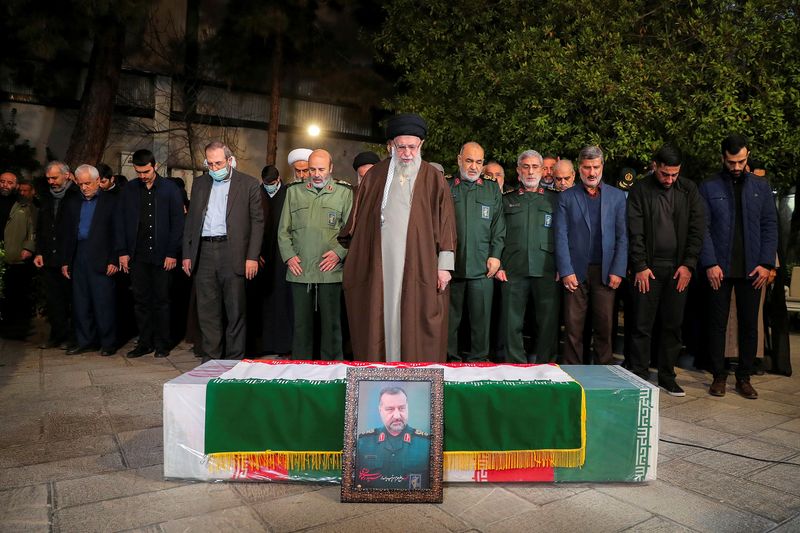 © Reuters. Iran's Supreme Leader, Ayatollah Ali Khamenei pray next to the coffin of senior adviser for Iran's Revolutionary Guards, Sayyed Razi Mousavi, who was killed in an Israeli air strike outside the Syrian capital Damascus, during his funeral in Tehran, Iran December 28, 2023. Office of the Iranian Supreme Leader/WANA (West Asia News Agency) via REUTERS 