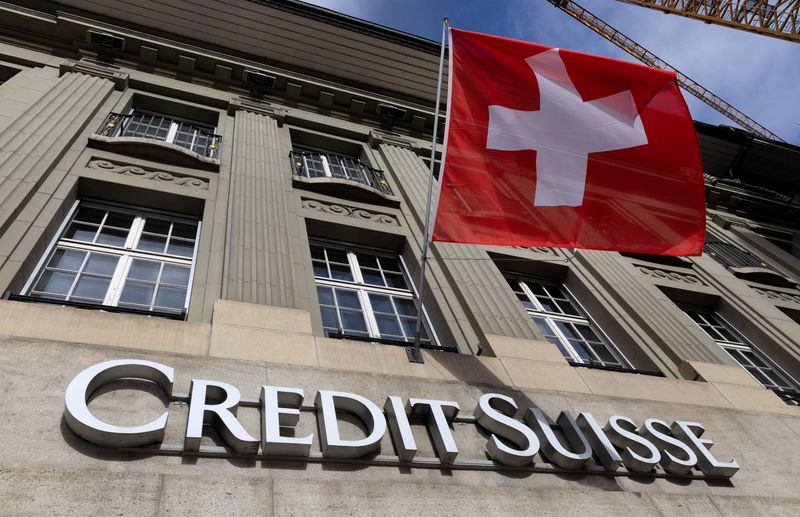 &copy; Reuters. FILE PHOTO: A Swiss flag is pictured above a logo of Credit Suisse in Bern, Switzerland, November 15, 2023.  REUTERS/Denis Balibouse/File Photo