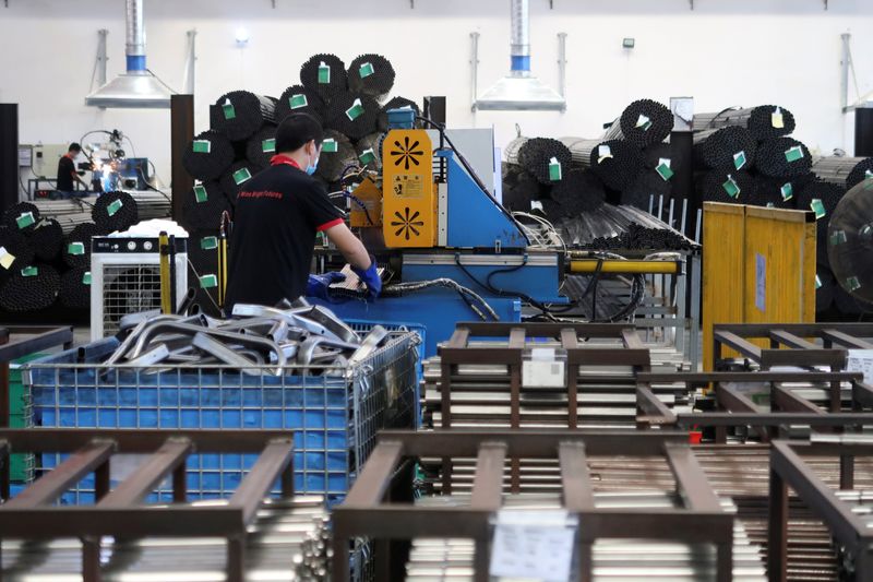 &copy; Reuters. FILE PHOTO: Employees work on the production line of American infant product and toy manufacturer Kids II Inc. at a factory in Jiujiang, Jiangxi province, China June 22, 2021. REUTERS/Gabriel Crossley