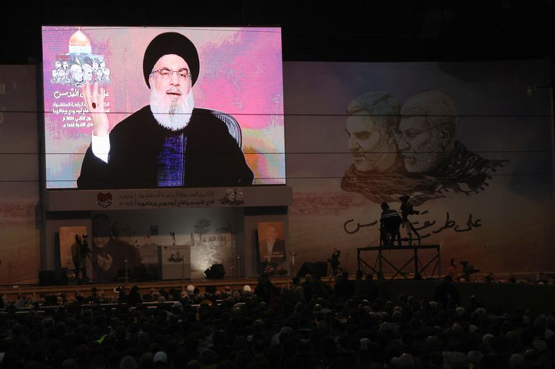 &copy; Reuters. Lebanon's Hezbollah leader Sayyed Hassan Nasrallah addresses his supporters through a screen during a ceremony to mark the fourth anniversary of the killing of senior Iranian military commander General Qassem Soleimani in a U.S. attack, in Beirut's southe