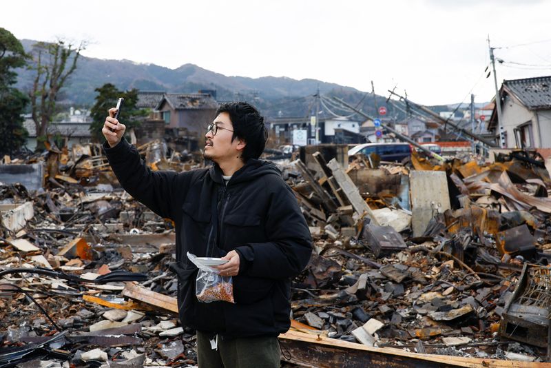 In the ruins of a historic market, a Japanese artisan looks for his cats