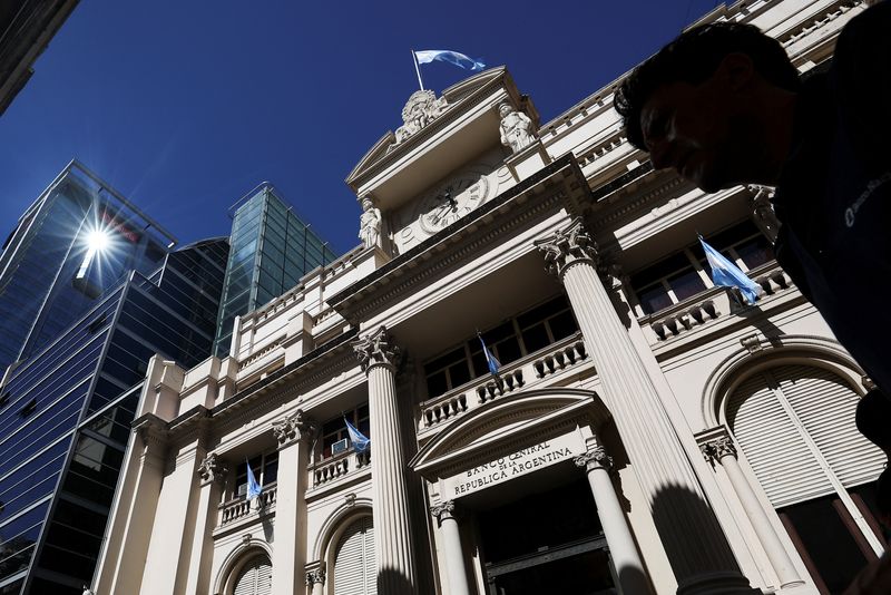&copy; Reuters. FILE PHOTO: A man walks past the facade of Argentina's Central Bank, one day after the inauguration of Argentina's President Javier Milei and his Vice President Victoria Villarruel, in Buenos Aires, Argentina, December 11, 2023. REUTERS/Agustin Marcarian/