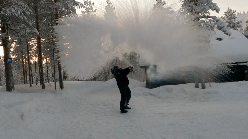 &copy; Reuters. A person throws boiling water into the air, which turns into steam, following cold weather, in Pyhatunturi, Finland January 1, 2024, in this screen grab obtained from social media video. Lauri Untamo/via REUTERS/File Photo