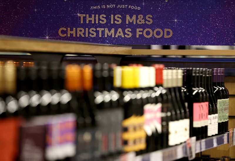 &copy; Reuters. FILE PHOTO: A Christmas advertising board is displayed in the wine aisle of the food hall at the M&S store inside the Trafford Centre in Manchester, Britain, December 14, 2023. REUTERS/Phil Noble/File Photo
