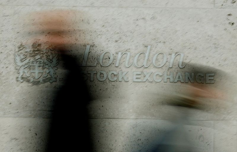 &copy; Reuters. FILE PHOTO: Pedestrians walk past the London Stock Exchange in the City of London December 12, 2006.  REUTERS/Stephen Hird/File Photo