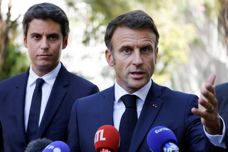 &copy; Reuters. French President Emmanuel Macron gestures as he addresses the audience next to French Education and Youth Minister Gabriel Attal at the 'lycee professionnel de l'Argensol' or Argensol vocational school in Orange, Southeastern France on September 1, 2023. 