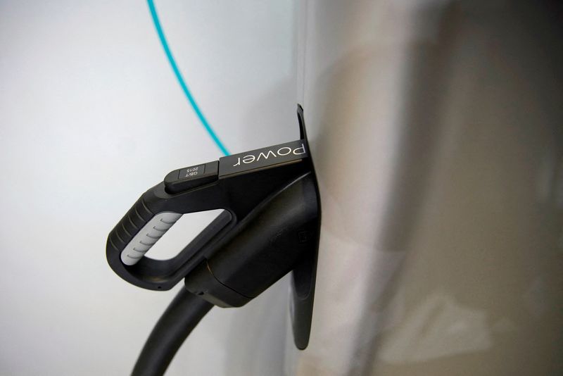 © Reuters. FILE PHOTO: A charging plug is seen on an electric vehicle (EV) at the second media day for the Shanghai auto show in Shanghai, China April 17, 2019.  REUTERS/Aly Song//File Photo