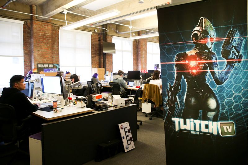 &copy; Reuters. FILE PHOTO: Employees work at the offices of Twitch Interactive Inc, a social video platform and gaming community owned by Amazon, in San Francisco, California, U.S., March 6, 2017.  REUTERS/Elijah Nouvelage