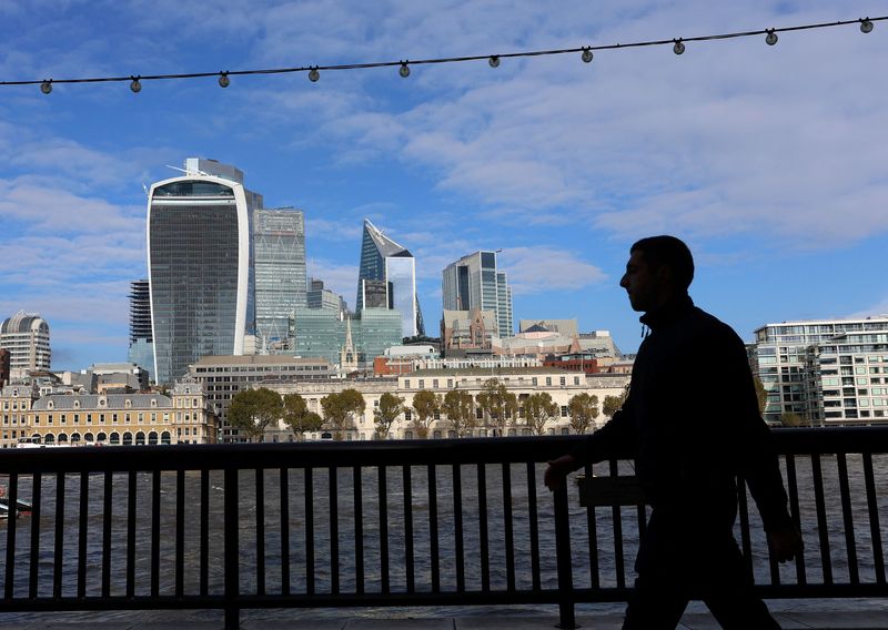 &copy; Reuters. People walk alongside the City of London financial district in London, Britain, October 25, 2023.  REUTERS/ Susannah Ireland/File Photo