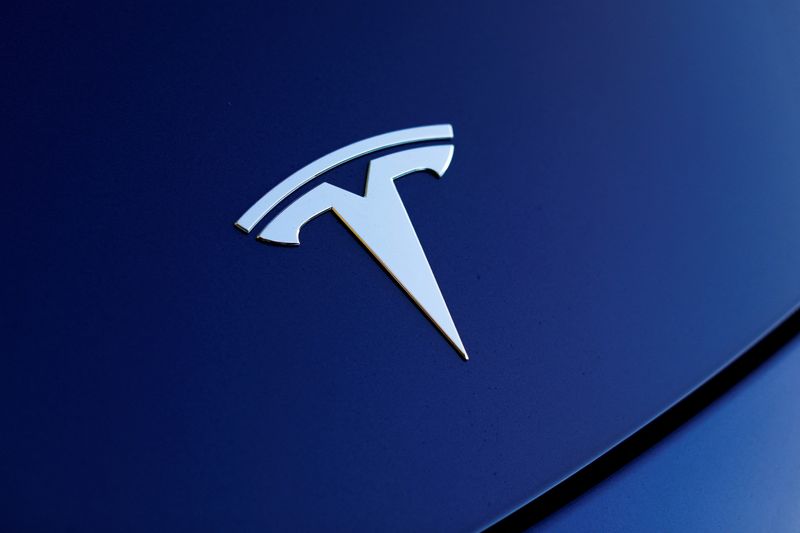 &copy; Reuters. FILE PHOTO: The front hood logo on a 2018 Tesla Model 3 electric vehicle is shown in this photo illustration taken in Cardiff, California, U.S., June 1, 2018. Picture taken June 1, 2018. REUTERS/Mike Blake/File Photo