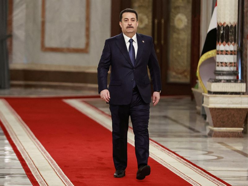 &copy; Reuters. Iraqi Prime Minister Mohammed Shia al-Sudani walks before an interview with Reuters in Baghdad,Iraq January 9, 2024. REUTERS/Thaier Al-Sudani