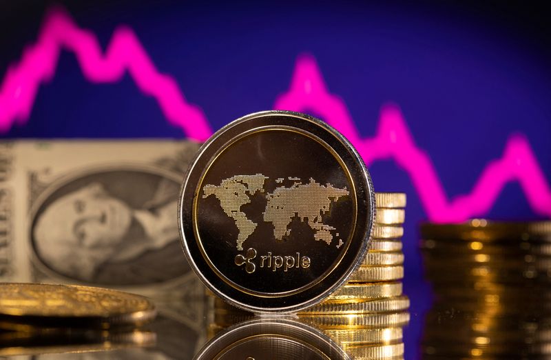 &copy; Reuters. FILE PHOTO: A representations of cryptocurrency Ripple is seen in front of a stock graph and U.S. dollar in this illustration taken, January 24, 2022. REUTERS/Dado Ruvic/Illustration/File Photo