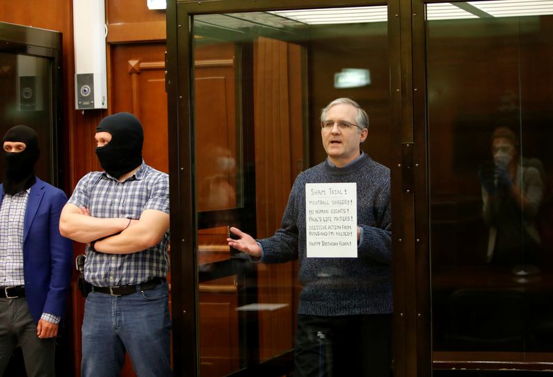 &copy; Reuters. Former U.S. Marine Paul Whelan, who was detained and accused of espionage, holds a sign as he stands inside a defendants' cage during his verdict hearing in Moscow, Russia June 15, 2020. REUTERS/Maxim Shemetov/File Photo