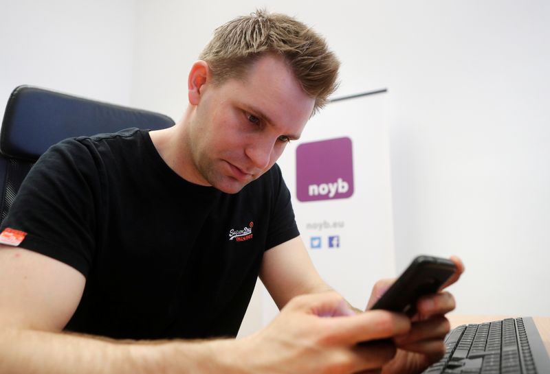 &copy; Reuters. Austrian lawyer and privacy activist Max Schrems checks his mobile phone in his office in Vienna, Austria, May 22, 2018. Picture taken May 22, 2018. REUTERS/Heinz-Peter Bader/File Photo