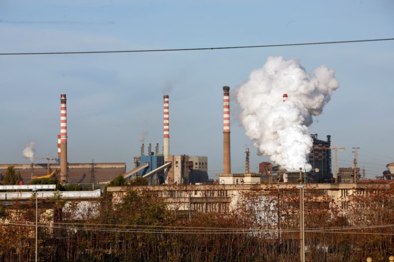 &copy; Reuters. FILE PHOTO: Steam comes out of the chimneys of the Ilva steel plant in Taranto, Italy, November 11, 2019. REUTERS/Ciro De Luca/File Photo 