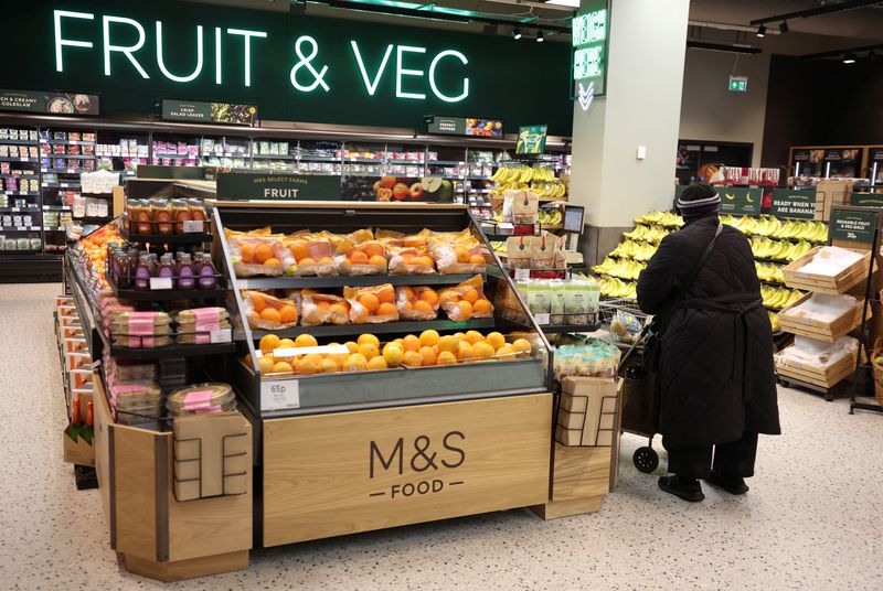&copy; Reuters. FILE PHOTO: A customer pushes a shopping trolley through the Fruit & Veg section of the food hall at the M&S store inside the Trafford Centre in Manchester, Britain, December 14, 2023. REUTERS/Phil Noble/File Photo