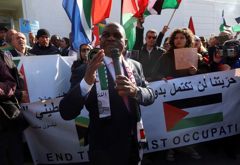 &copy; Reuters. South Africa's ambassador to Tunisia Siphosezwe Masango speaks during a protest, as judges at The International Court of Justice (ICJ) in the Hague  hear a request for emergency measures to order Israel to stop its military actions in Gaza, outside the So
