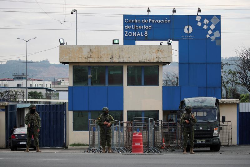 Ecuador security forces conduct raids as prison guards remain hostage