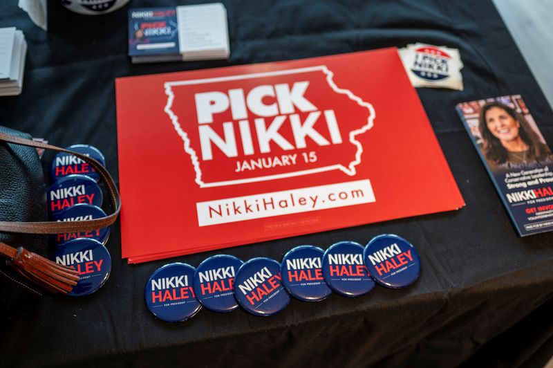 &copy; Reuters. Badges in support of Republican presidential candidate and former U.S. Ambassador to the United Nations Nikki Haley, lie next to signs and pamphlets during a campaign event ahead of the caucus vote in Ankeny, Iowa, U.S., January 11, 2024.  REUTERS/Sergio 
