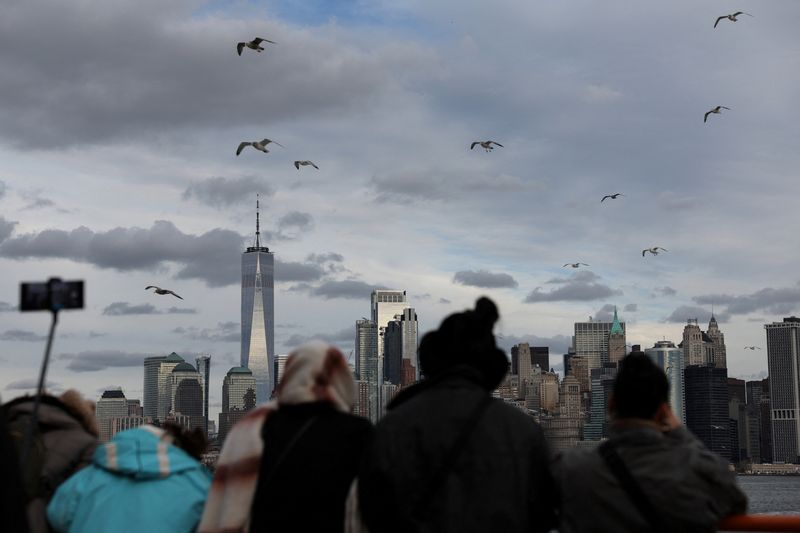 &copy; Reuters. One World Trader Center stands in Lower Manhattan as people watch aboard the Staten Island Ferry in New York City, U.S., December 4, 2023. REUTERS/Shannon Stapleton/File Photo