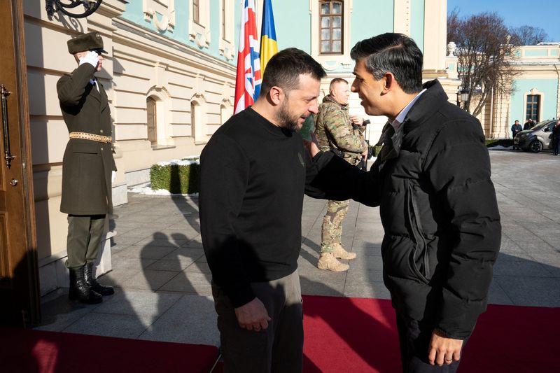 &copy; Reuters. Prime Minister Rishi Sunak is welcomed by President Volodymyr Zelenskiy (left) during a visit to the Presidential Palace in Kyiv, Ukraine, to announce a major new package of ?2.5 billion in military aid to the country over the coming year, January 12, 202