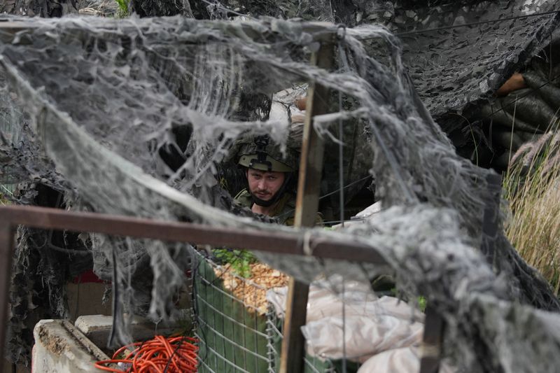 &copy; Reuters. An Israeli soldier looks out from a military outpost in Kibbutz Hanita, close to Israel's Lebanese border in northern Israel, January 11, 2024. REUTERS/Alexandre Meneghini