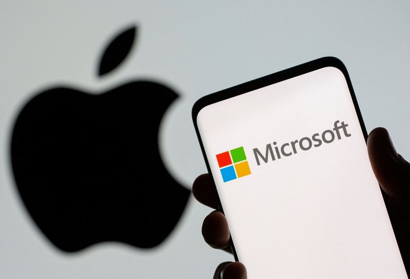 &copy; Reuters. FILE PHOTO: Microsoft logo is seen on the smartphone in front of displayed Apple logo in this illustration taken, July 26, 2021. REUTERS/Dado Ruvic/Illustration/File Photo