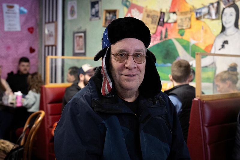 &copy; Reuters. Dave Brummel, a supporter of Republican presidential candidate and former U.S. President Donald Trump, poses for a portrait as he has breakfast in a cafe, in Des Moines, Iowa, U.S., January 13, 2024. REUTERS/Marco Bello