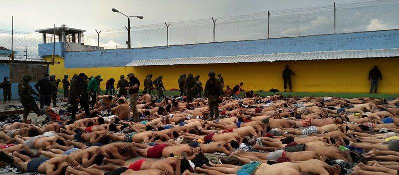 &copy; Reuters. Inmates lie on the floor after Ecuador's police and armed forces freed prison staff members who had been held hostage by the prisoners, in Ambato, Ecuador, in this Handout picture made available on January 13, 2024. Armed Forces of Ecuador/Handout via REU