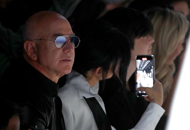 &copy; Reuters. FILE PHOTO: Jeff Bezos watches as model presents a creation for Dolce & Gabbana Fall/Winter 2024/25 men's collection in Milan, Italy January 13, 2024. REUTERS/Alessandro Garofalo/File Photo