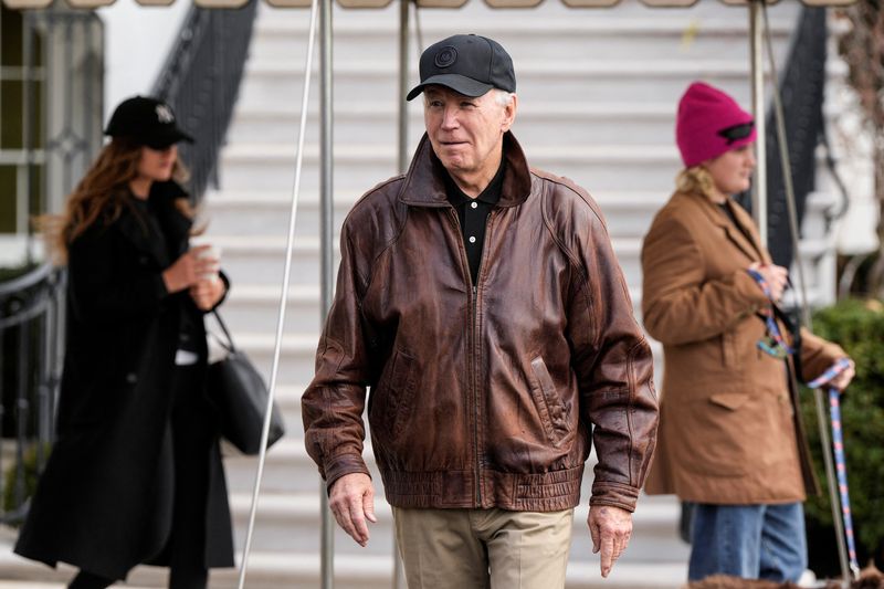 &copy; Reuters. U.S. President Joe Biden walks to speak to the media before he departs for Camp David from the White House in Washington, U.S., January 13, 2024.      REUTERS/Joshua Roberts