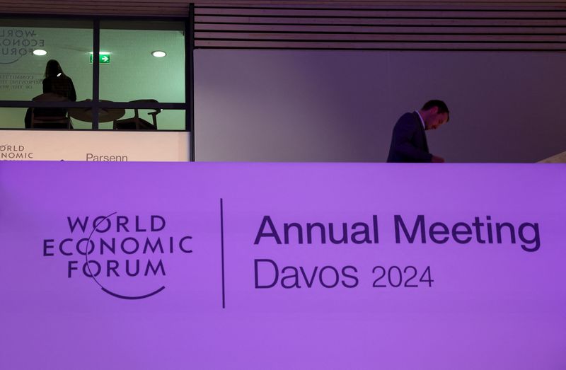 &copy; Reuters. A person walks inside the venue, on the first day of the annual meeting in Davos, Switzerland, January 15, 2024. REUTERS/Denis Balibouse