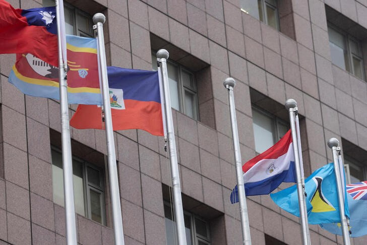 © Reuters. An empty flag pole where Nauru's flag used to fly is pictured next to flags of other countries at the Diplomatic Quarter which houses embassies in Taipei, Taiwan January 15, 2024. REUTERS/Carlos Garcia Rawlins