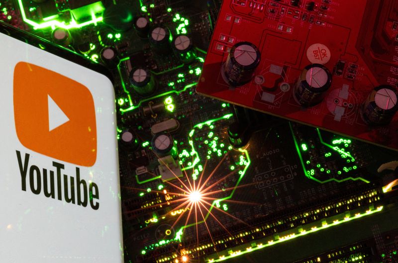 &copy; Reuters. A smartphone with a displayed YouTube logo is placed on a computer motherboard in this illustration taken February 23, 2023. REUTERS/Dado Ruvic/Illustration/File Photo