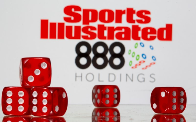 &copy; Reuters. Gambling dice are seen in front of Sports Illustrated and 888 Holdings logos in illustration taken, June 24, 2021. REUTERS/Dado Ruvic/Illustration/File Photo