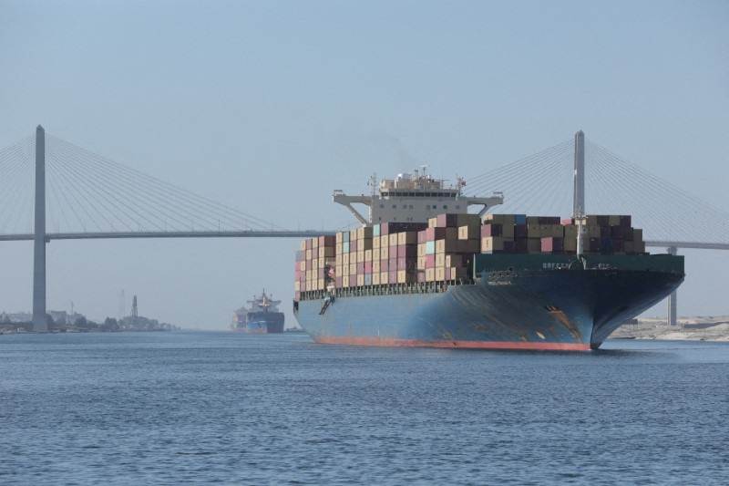 &copy; Reuters. FILE PHOTO: A container ship is seen near Suez Canal Bridge which is known as the "Peace Bridge" following a Suez Canal tugboat sinking yesterday after colliding with a Hong Kong-flagged LPG tanker in the waterway of the Suez Canal, Egypt, August 6, 2023.