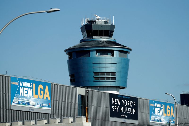 &copy; Reuters. FILE PHOTO: The control tower at LaGuardia Airport in New York City is seen after hundreds of flights were grounded or delayed at New York-area airports as more air traffic controllers called in sick on Friday, in one of the most tangible signs yet of dis