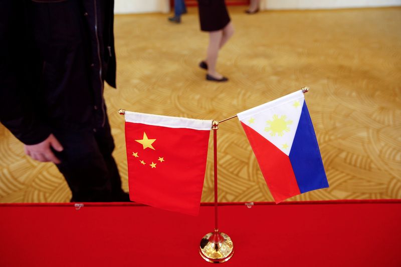 &copy; Reuters. FILE PHOTO: National flags are placed outside a room where Philippine Finance Secretary Carlos Dominguez and China's Commerce Minister Gao Hucheng address reporters after their meeting in Beijing, China, January 23, 2017. REUTERS/Damir Sagolj/File Photo