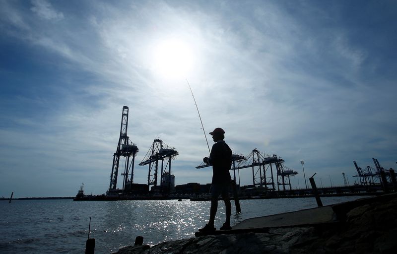 &copy; Reuters. FILE PHOTO: A man is silhouetted as he fishes near Northport in Klang outside Kuala Lumpur June 6, 2014. REUTERS/Samsul Said/File Photo