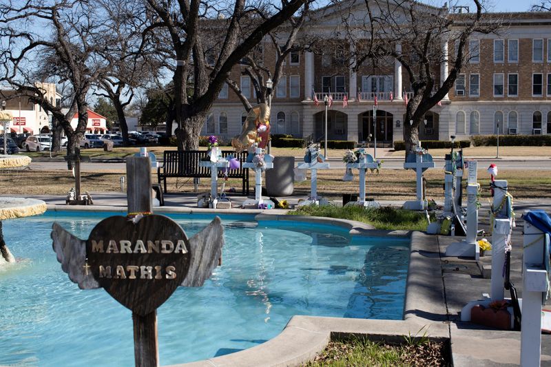 &copy; Reuters. Memorial crosses line a fountain in the town square, as U.S. Attorney General Merrick Garland announces the results of a review into the law enforcement response to a 2022 mass shooting at Robb Elementary in Uvalde, Texas, U.S., January 18, 2024. REUTERS/
