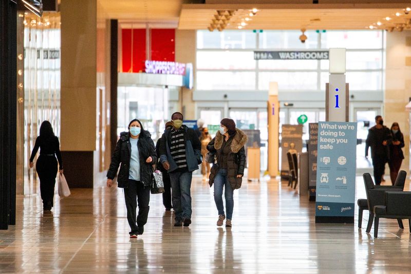 &copy; Reuters. FILE PHOTO: People walks inside Yorkdale Shopping Centre as the city enters the first day of a renewed coronavirus lockdown due to a spike in cases in Toronto, Ontario, Canada November 23, 2020.  REUTERS/Carlos Osorio/File Photo