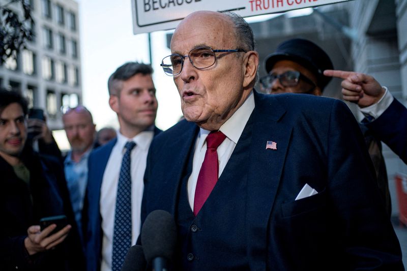 &copy; Reuters. FILE PHOTO: Former New York Mayor Rudy Giuliani departs the U.S. District Courthouse after he was ordered to pay $148 million in his defamation case in Washington, U.S., December 15, 2023. REUTERS/Bonnie Cash/File Photo