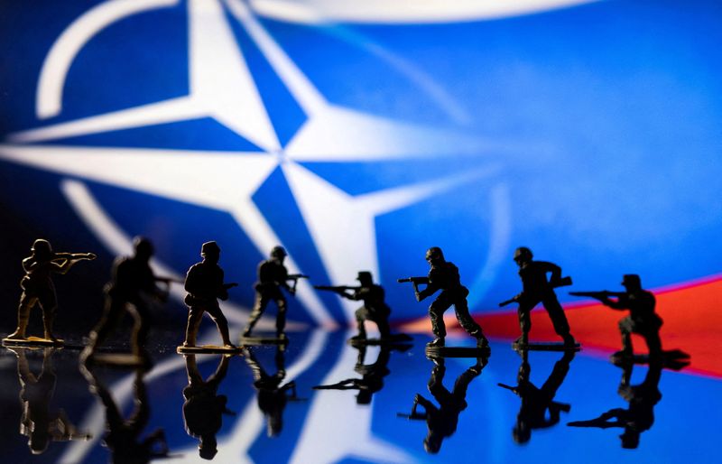 &copy; Reuters. FILE PHOTO: Army soldier figurines are displayed in front of the NATO logo and Russian flag colours background in this illustration taken, February 13, 2022. REUTERS/Dado Ruvic/Illustration/File Photo