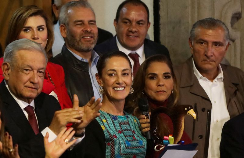 &copy; Reuters. FILE PHOTO: Former Mexico City Mayor Claudia Sheinbaum received the ceremonial baton of command from Mexico's President Andres Manuel Lopez Obrador after she was elected by the ruling National Regeneration Movement (MORENA) as its candidate to succeed him